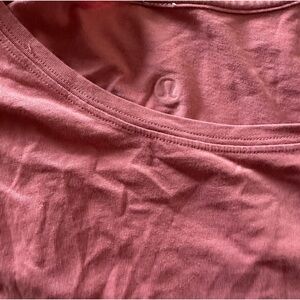 Light pink size Medium Lululemon workout top.